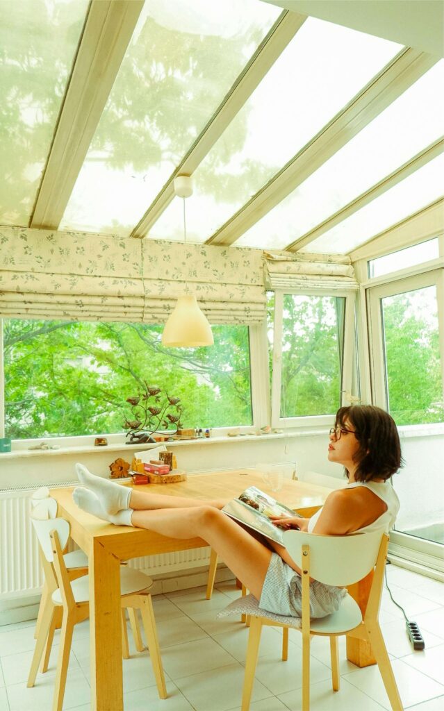 Woman sat in conservatory